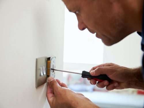Electrician Repairing Domestic Light Switch